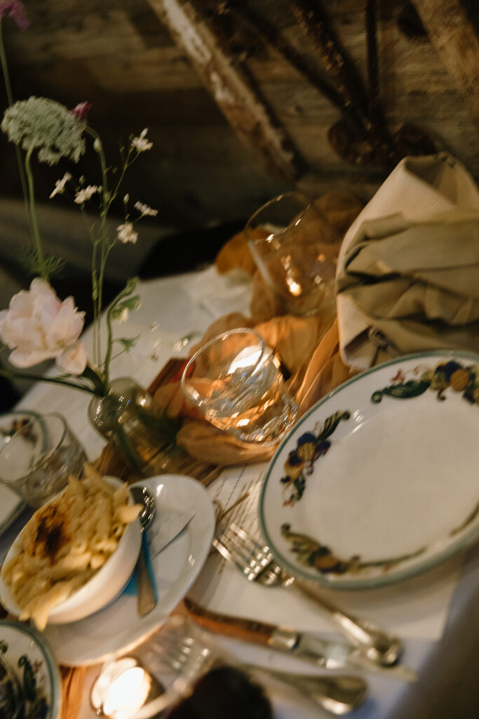 Blur motion photo of wedding tablescape and vintage decorative plates.