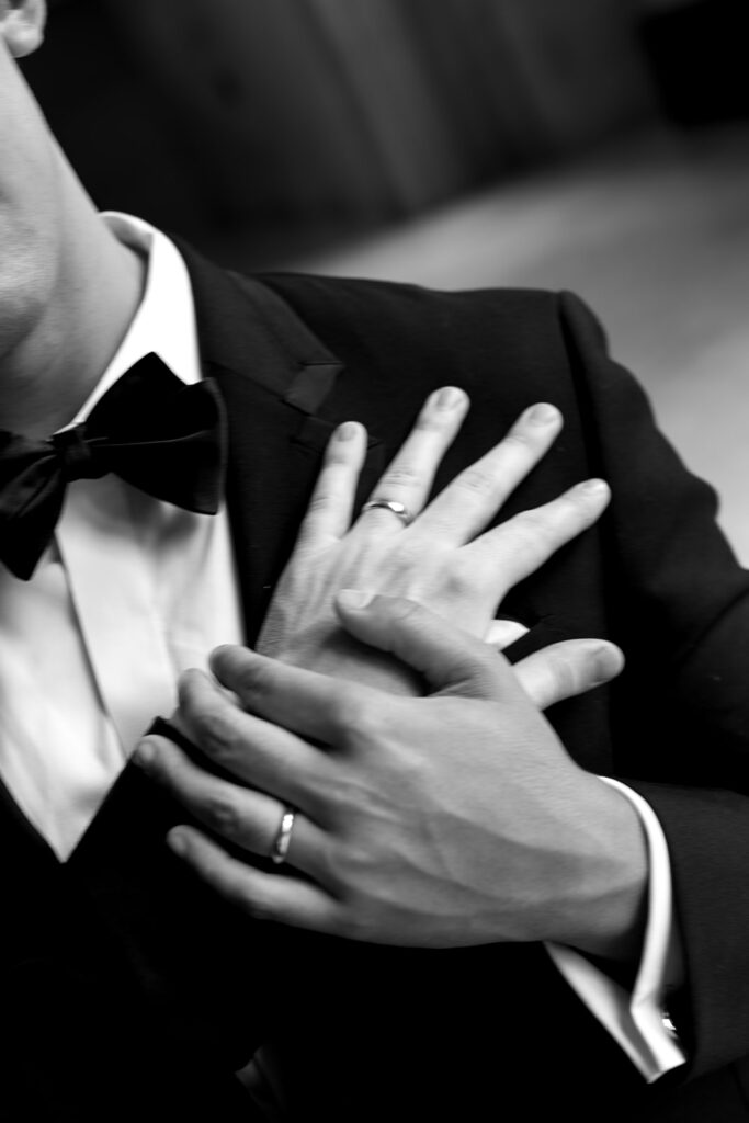 Both grooms hands detail shots with their wedding rings.