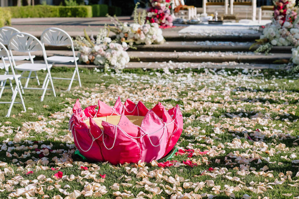 Indian wedding ceremony simple small pink doli that resembles a lotus flower.