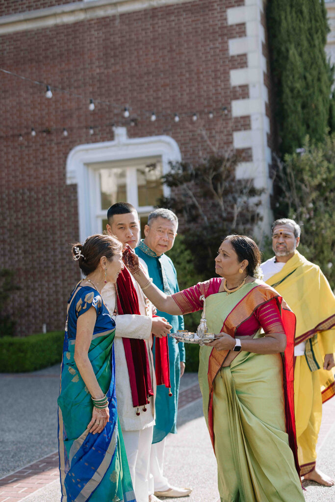 Brides family with grooms family during the traditional Indian ceremony.